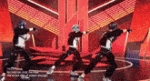 a group of people are dancing on a stage with the words no one can stop me now