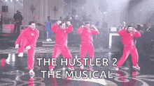 a group of men are dancing on a stage with the words " the hustler 2 the musical " on the bottom