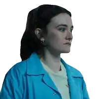 a woman wearing a blue jacket and a white t-shirt with the letter a on the front