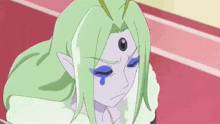 a cartoon character with green hair and blue eyes has a tear coming out of her eye