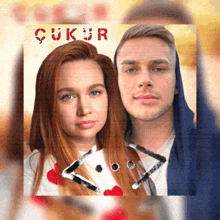 a man and a woman are on a poster that says ' ukur ' on it