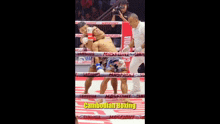 two men in a boxing ring with cambodian boxing written on the side