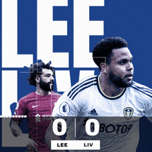 two soccer players are standing next to each other and the score is 0-0