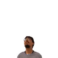 a man with glasses holds a green plus sign on his head