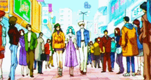 a group of people are walking down a street in a city .