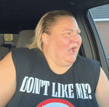 a woman wearing a shirt that says " don 't like me "