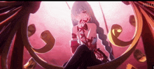 a girl in a red dress is sitting on a swing and the word melo is on the bottom right