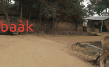 the word baak is on a dirt road