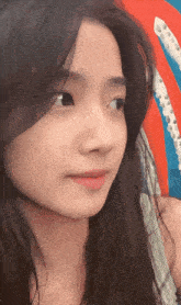 a close up of a woman 's face with long hair