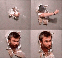 a man 's arm is sticking out of a hole in the wall