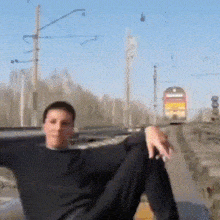Man Sits On The Rails GIF - Man Sits On The Rails Rails Man GIFs