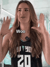 a woman wearing a jersey with the number 20