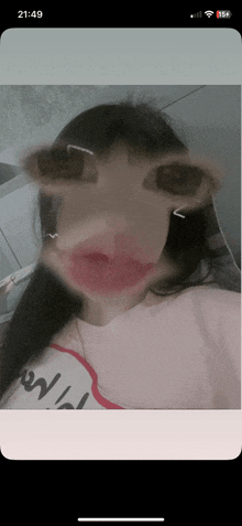 a phone screen shows a picture of a girl 's face with the time 21:49