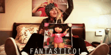 a woman is sitting on a bed holding a dora doll and the words fantastico are above her