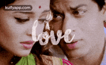a man and a woman are standing next to each other and the word love is written over them .