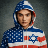 a woman is wearing a hoodie with an american flag and a jewish star on it