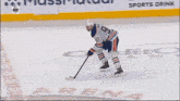 a hockey game is being played in front of a banner for verizon