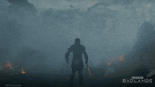 a poster for predator badlands shows a man with a knife