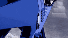 a close up of a blue item with a few letters on it