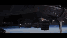 a large space ship is docked at a station in space