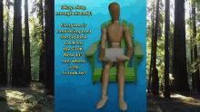 a wooden mannequin is sitting in a green chair holding a piece of paper in front of a forest