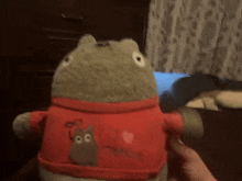 a stuffed animal with a red shirt that says i love tokyo
