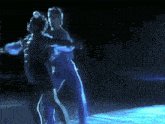 a man and a woman are dancing in the dark