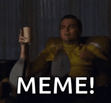 a man is sitting on a couch and pointing at the camera with the word meme on the screen