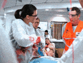 a man in an orange vest with the number 11 on it stands next to a woman in a white gown