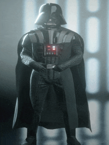darth vader from star wars stands in front of a row of lights