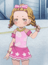 a little girl in a pink dress with white stars on the skirt