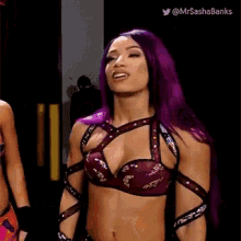 a woman with purple hair is standing next to another woman and says " you mean when alexa took a walk . "