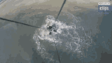 an aerial view of a person riding a wave with the words collab cling below