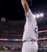 a baseball player in a white jersey with the number 25 on it