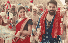 a man and a woman are dancing together in front of a crowd of people .