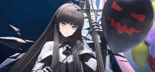 a girl with long black hair is holding a black balloon