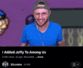 a man in a blue shirt is smiling in front of a cartoon character that says added jeffy to among us on it