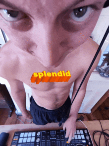 a shirtless man stands in front of a dj controller with the word splendid on his chest