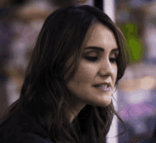 a close up of a woman 's face with a smile on her face