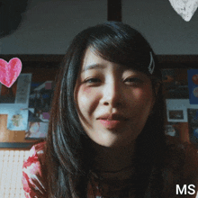 a woman 's face is surrounded by pink hearts and the letters ms are on the bottom right