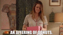 Supergirl An Offering Of Donuts GIF - Supergirl An Offering Of Donuts Donut GIFs