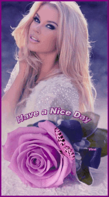 a picture of a woman with a purple rose and the words have a nice day on the bottom