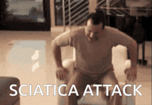 a man is sitting on a couch with the words sciatica attack written on the bottom