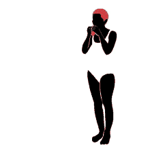 a woman in a bathing suit holds a red cat