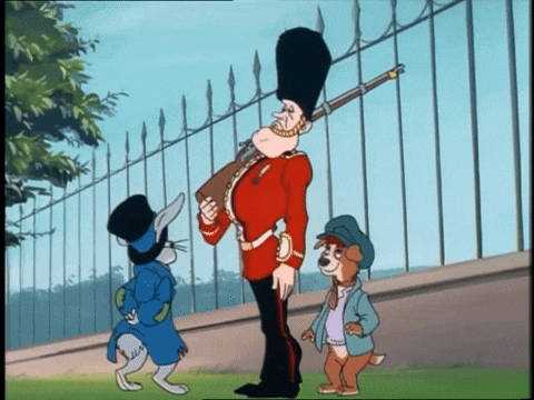 Oliver takes the hat from the guard's head