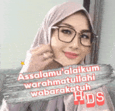 a woman wearing glasses and a hijab says assalamu ' alaikum warahmatullahi wabarakatuh hds