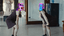 two women standing next to each other with pixelated faces on them