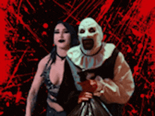 a woman is standing next to a man in a clown costume