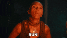 a woman in a tank top says run in the dark