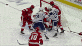 a hockey player with the number 48 on his jersey is surrounded by other players